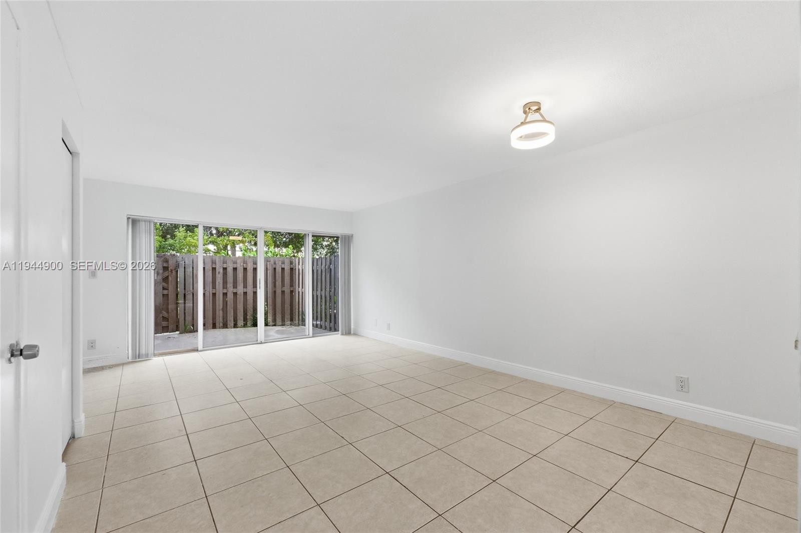 3003 Northwest 5th Terrace, Unit 2 Pompano Beach, FL 33064 - Photo 9 of 28 an empty room with entrance