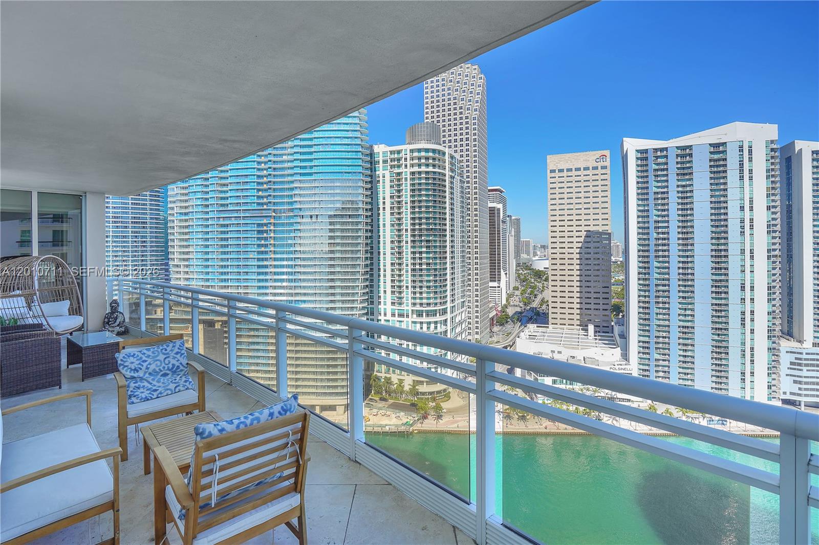 901 Brickell Key Boulevard, Unit 2807 Miami, FL 33131 - Photo 5 of 29 a view of a balcony with mountain view and wooden floor