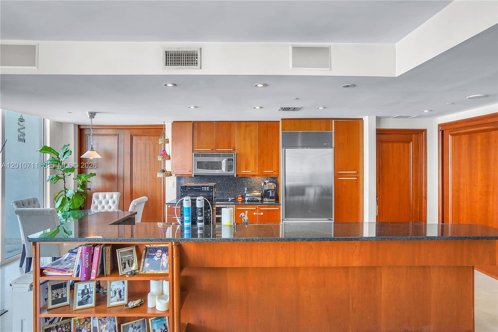 901 Brickell Key Boulevard, Unit 2807 Miami, FL 33131 - Photo 10 of 29 a living room with furniture and painting on the wall