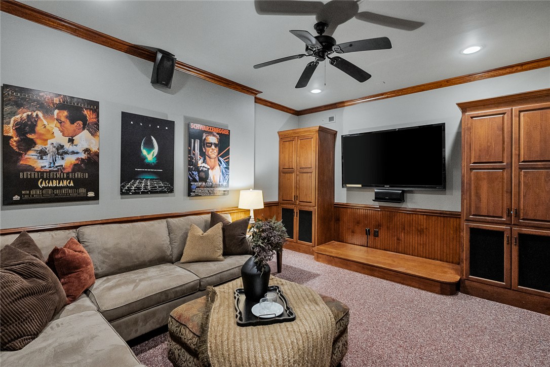 200 Graylyn Drive Anderson, SC 29621 - Photo 35 of 48 Unwind in this dedicated media room, featuring custom built-in cabinetry and ample seating for entertainment.