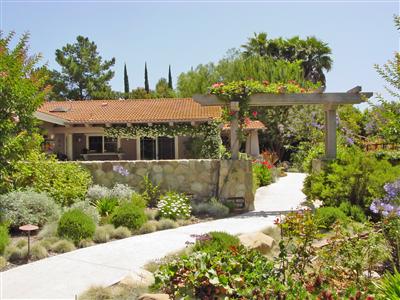 1853 Meiners Road Ojai, CA 93023 - Photo 1 of 9 a front view of a house with a yard