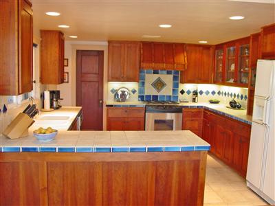 1853 Meiners Road Ojai, CA 93023 - Photo 3 of 9 a kitchen with stainless steel appliances kitchen island granite countertop a sink and a refrigerator