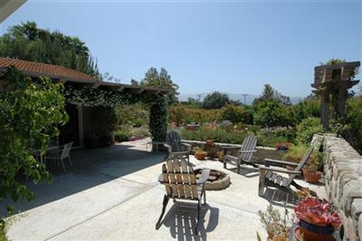 1853 Meiners Road Ojai, CA 93023 - Photo 6 of 9 a view of a patio with table and chairs and potted plants