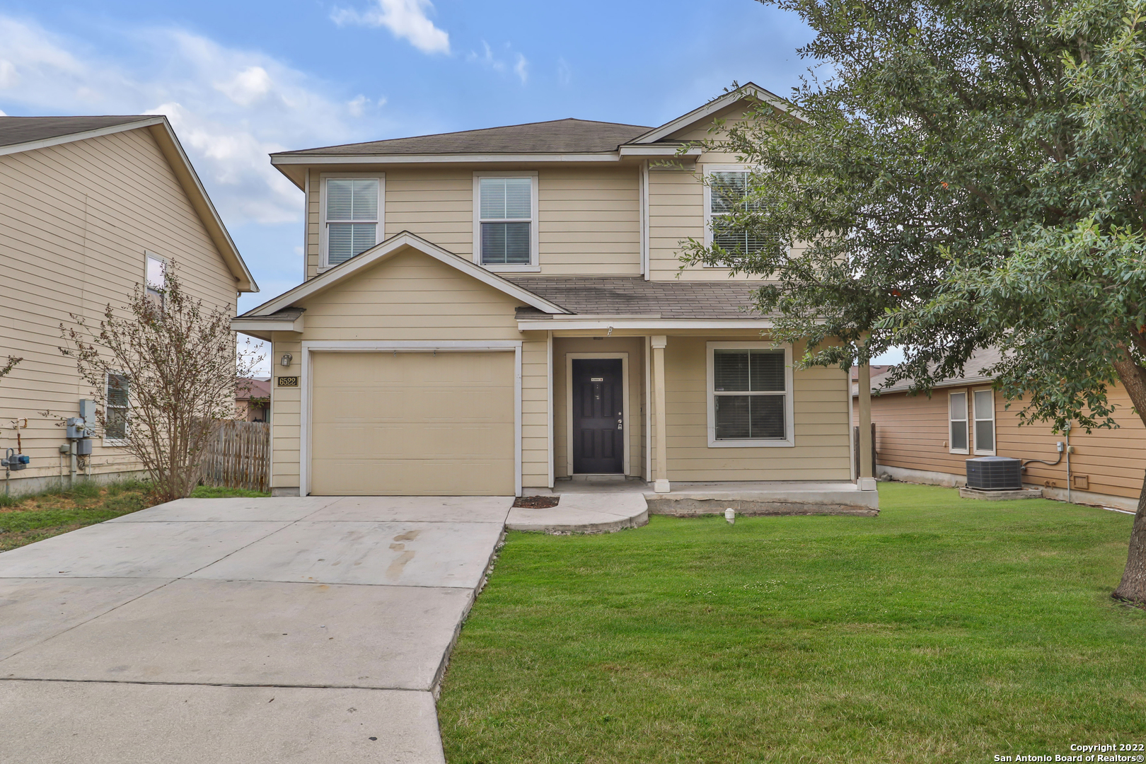 6522 Poseidon Way Converse, TX 78109 - Photo 1 of 1 a front view of a house with a garden and yard