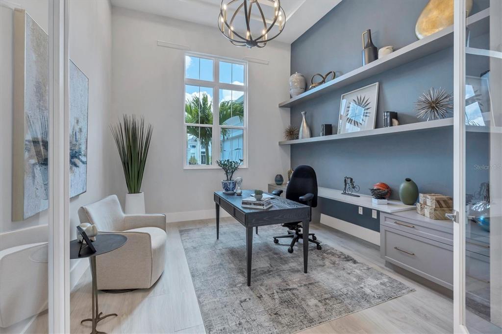 8477 Pavia Way Lakewood Ranch, FL 34202 - Photo 14 of 67 a living room with furniture a window and a potted plant