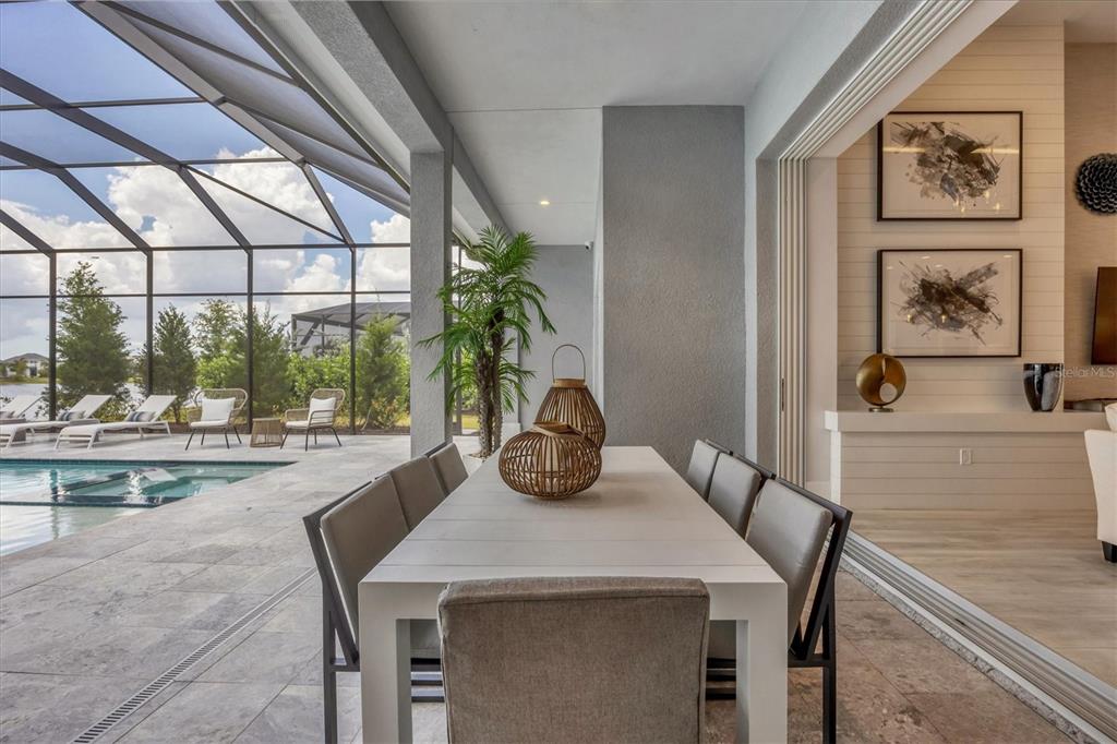 8477 Pavia Way Lakewood Ranch, FL 34202 - Photo 33 of 67 a view of a dining room with furniture window and outside view