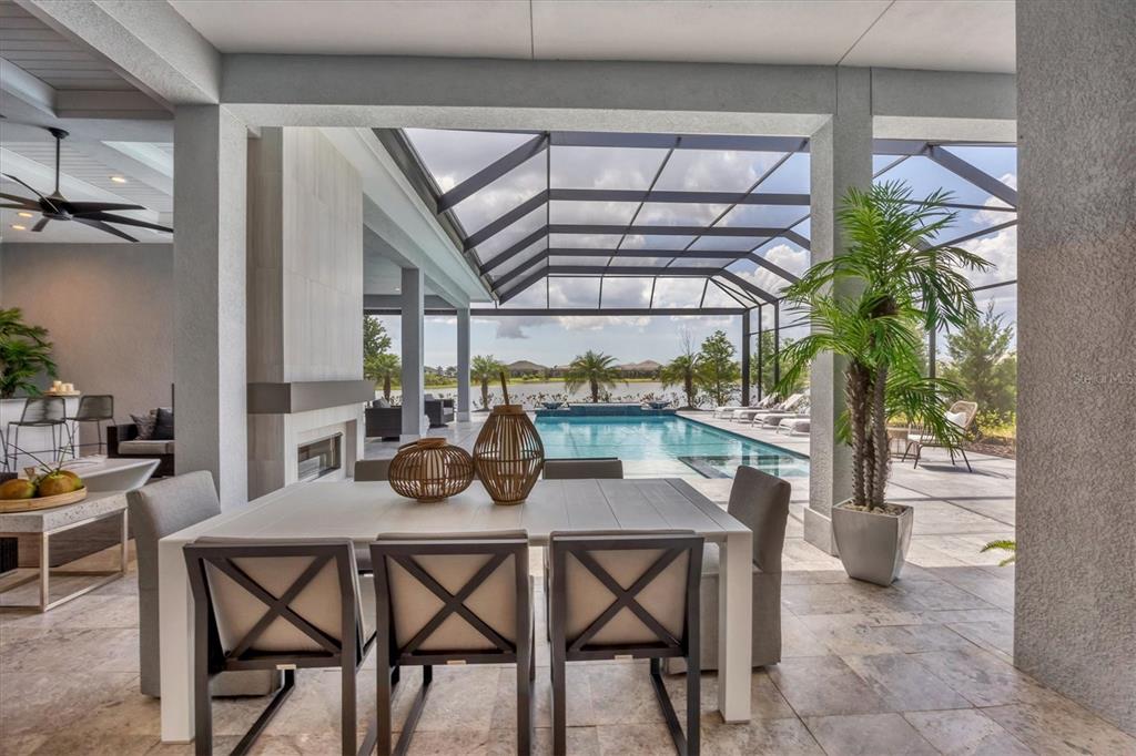 8477 Pavia Way Lakewood Ranch, FL 34202 - Photo 34 of 67 a dining room with furniture and a potted plant