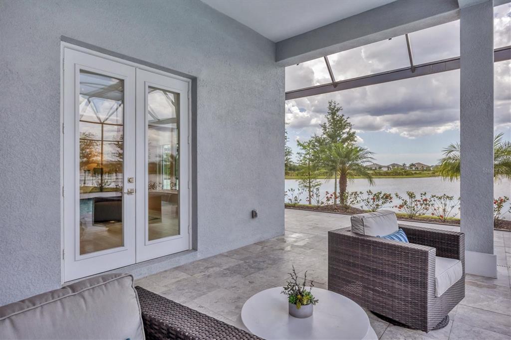 8477 Pavia Way Lakewood Ranch, FL 34202 - Photo 35 of 67 a living room with furniture and a large window