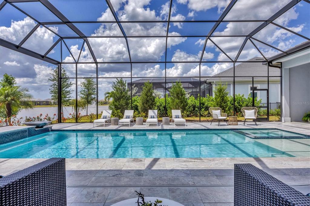 8477 Pavia Way Lakewood Ranch, FL 34202 - Photo 41 of 67 a view of a swimming pool with a patio