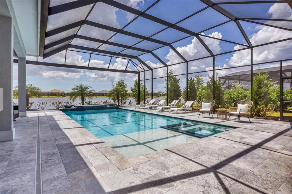 8477 Pavia Way Lakewood Ranch, FL 34202 - Photo 42 of 67 a view of a swimming pool with a patio