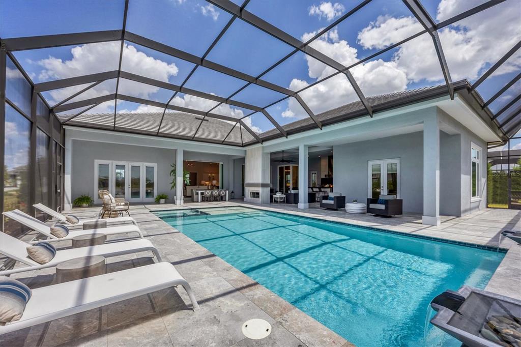8477 Pavia Way Lakewood Ranch, FL 34202 - Photo 45 of 67 a view of a house with backyard porch and sitting area