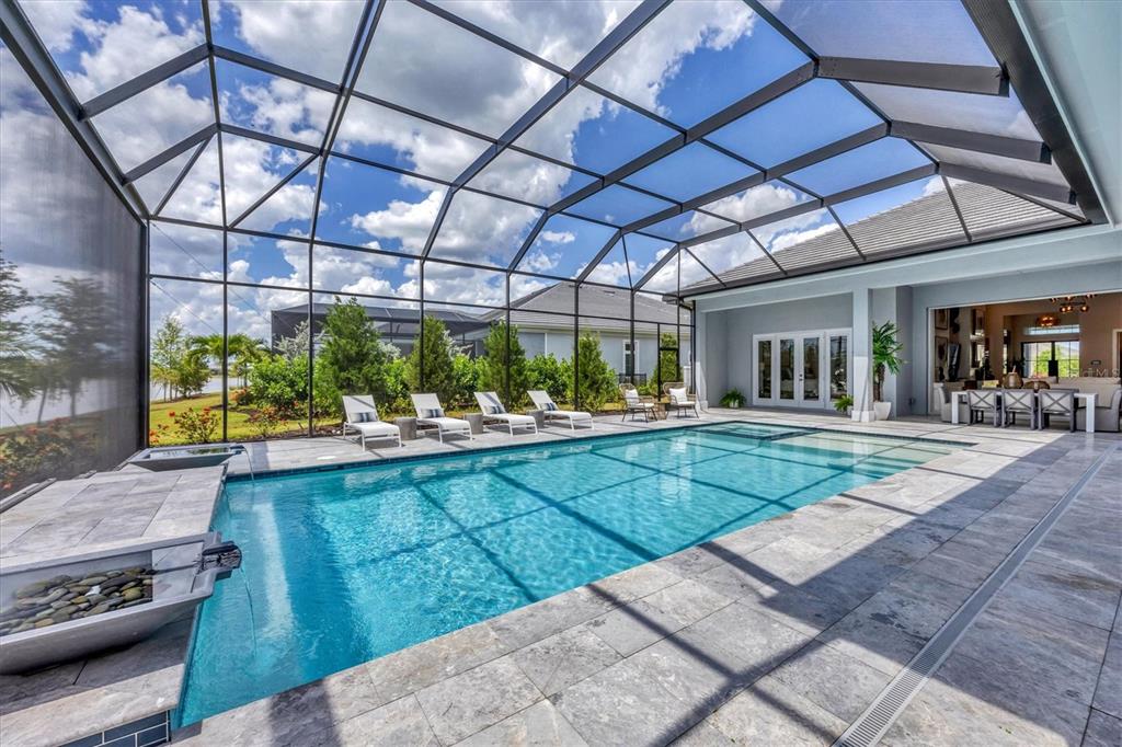 8477 Pavia Way Lakewood Ranch, FL 34202 - Photo 47 of 67 a view of a backyard with sitting area