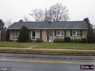 95 Mull Avenue Sinking Spring, PA 19608 - Photo 1 of 1 a front view of a house with a garden