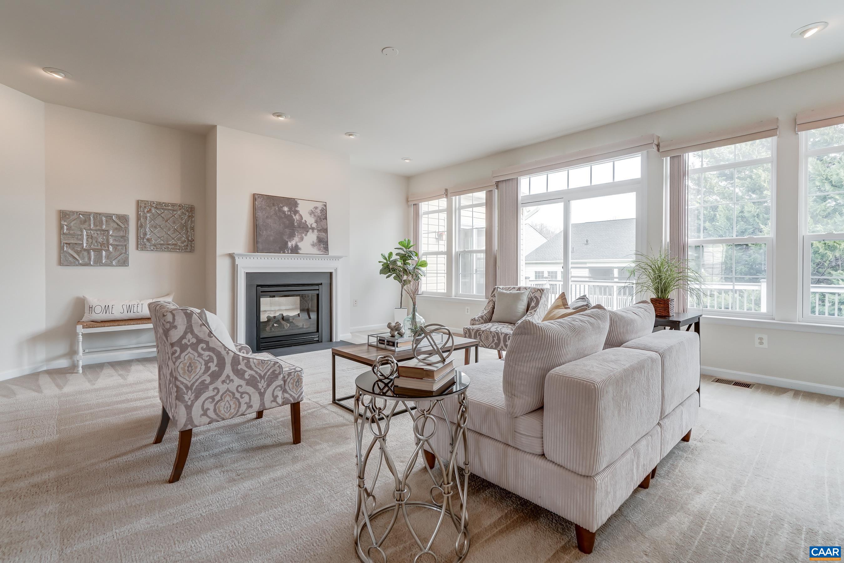 65 Prestwood Drive Ruckersville, VA 22968 - Photo 12 of 61 a living room with furniture and a fireplace