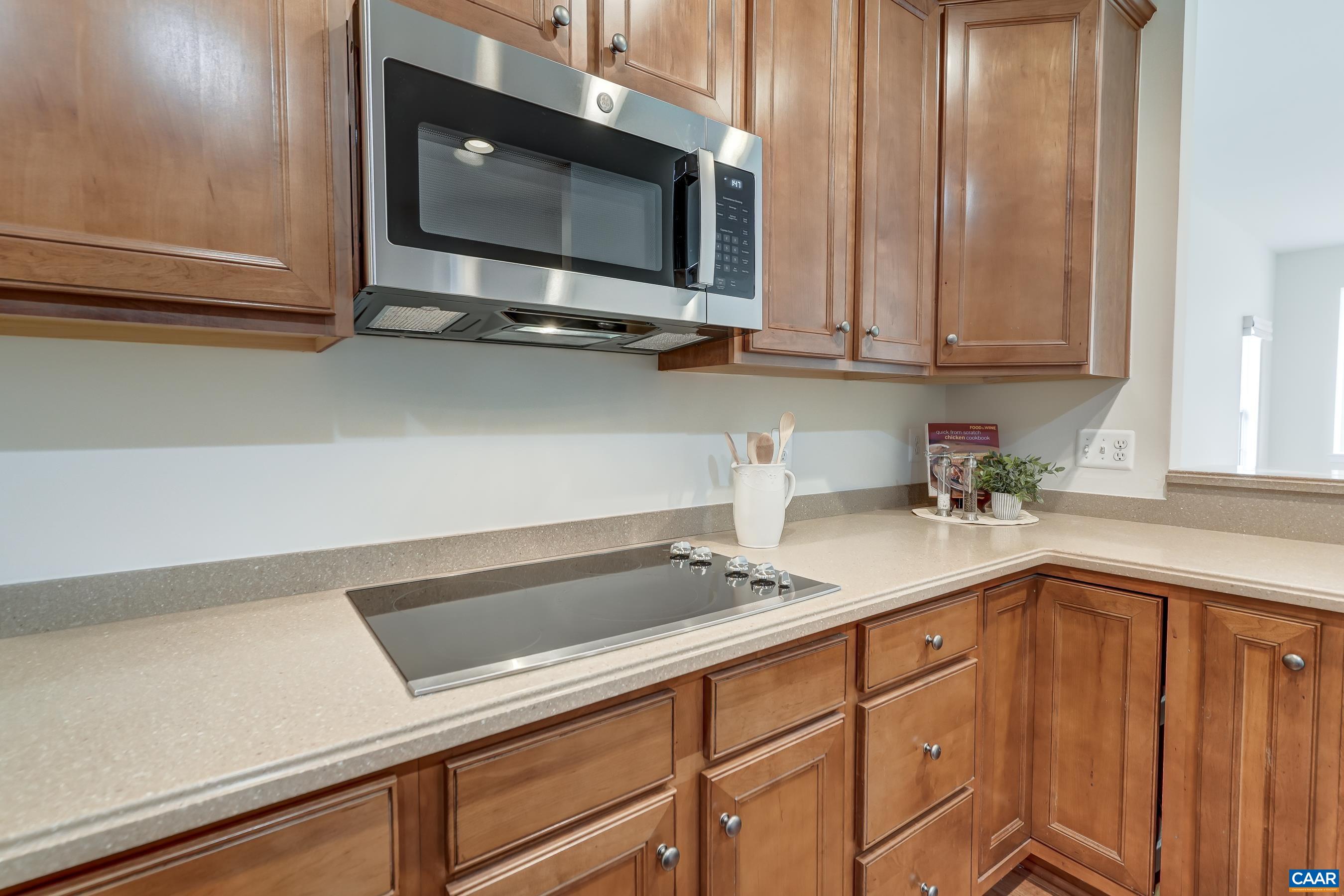 65 Prestwood Drive Ruckersville, VA 22968 - Photo 19 of 61 a kitchen with a sink microwave and cabinets
