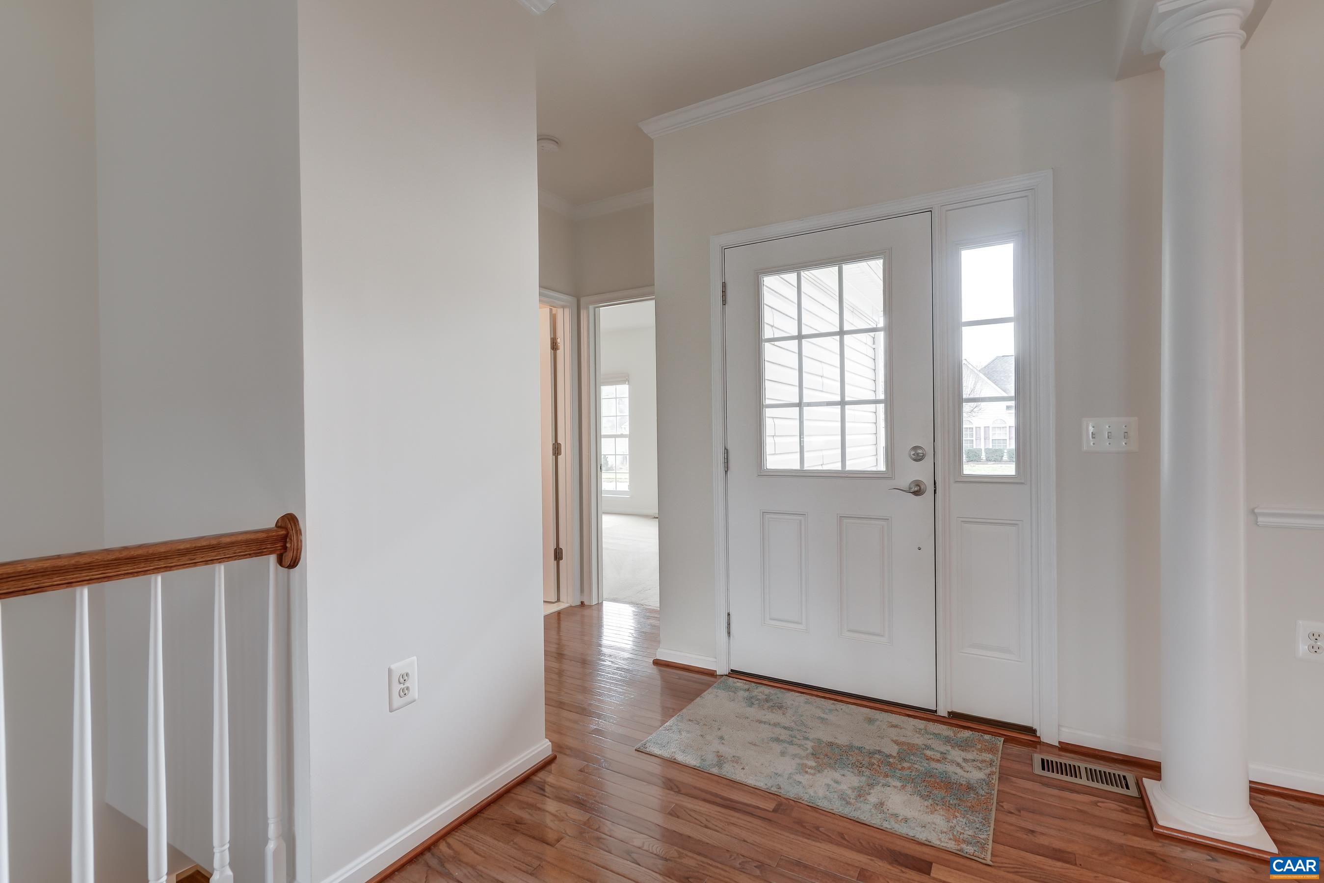 65 Prestwood Drive Ruckersville, VA 22968 - Photo 7 of 61 a view of an empty room with wooden floor and a window