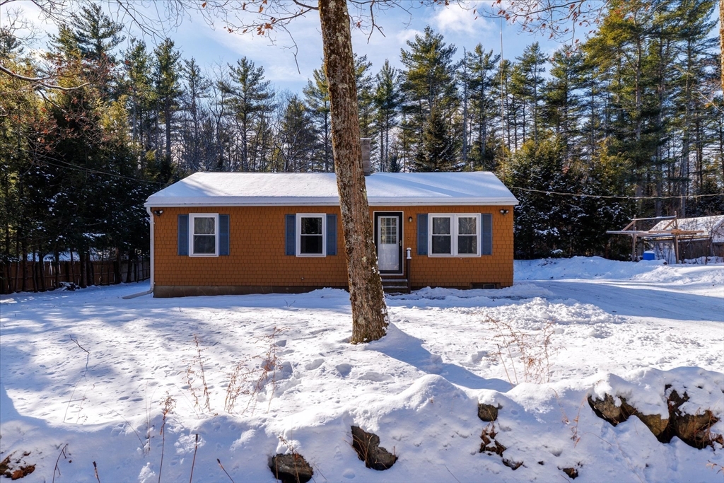 690 Clark Street Gardner, MA 01440 - Photo 2 of 26 a front view of a house with a yard covered in snow