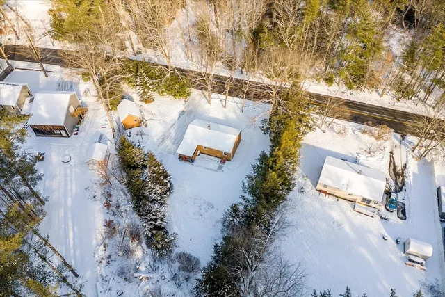 an aerial view of residential house with outdoor space