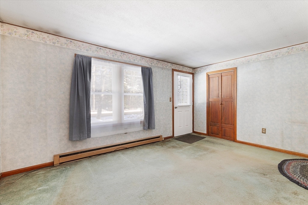 690 Clark Street Gardner, MA 01440 - Photo 4 of 26 an empty room with windows