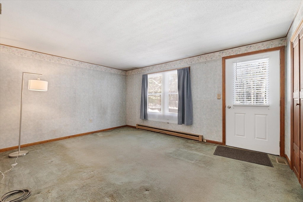 690 Clark Street Gardner, MA 01440 - Photo 5 of 26 an empty room with windows