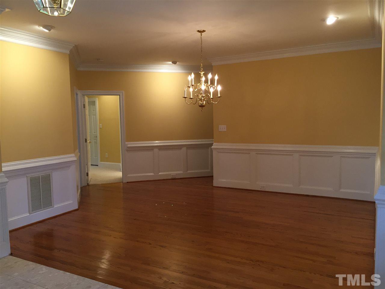 127 Yorkchester Way Raleigh, NC 27615 - Photo 4 of 25 wooden floor in an empty room with a window
