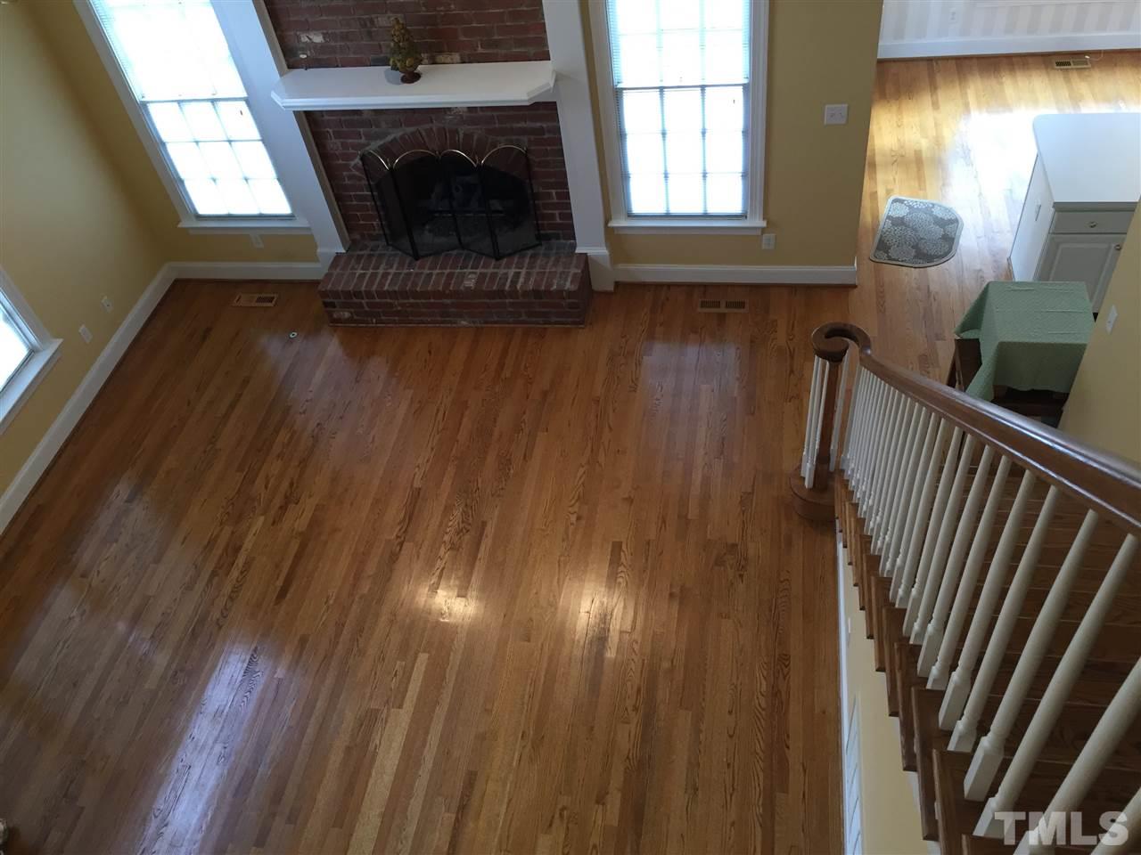 127 Yorkchester Way Raleigh, NC 27615 - Photo 6 of 25 a view of an empty room with wooden floor and a window