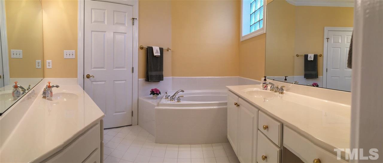 127 Yorkchester Way Raleigh, NC 27615 - Photo 9 of 25 a bathroom with a sink and a mirror