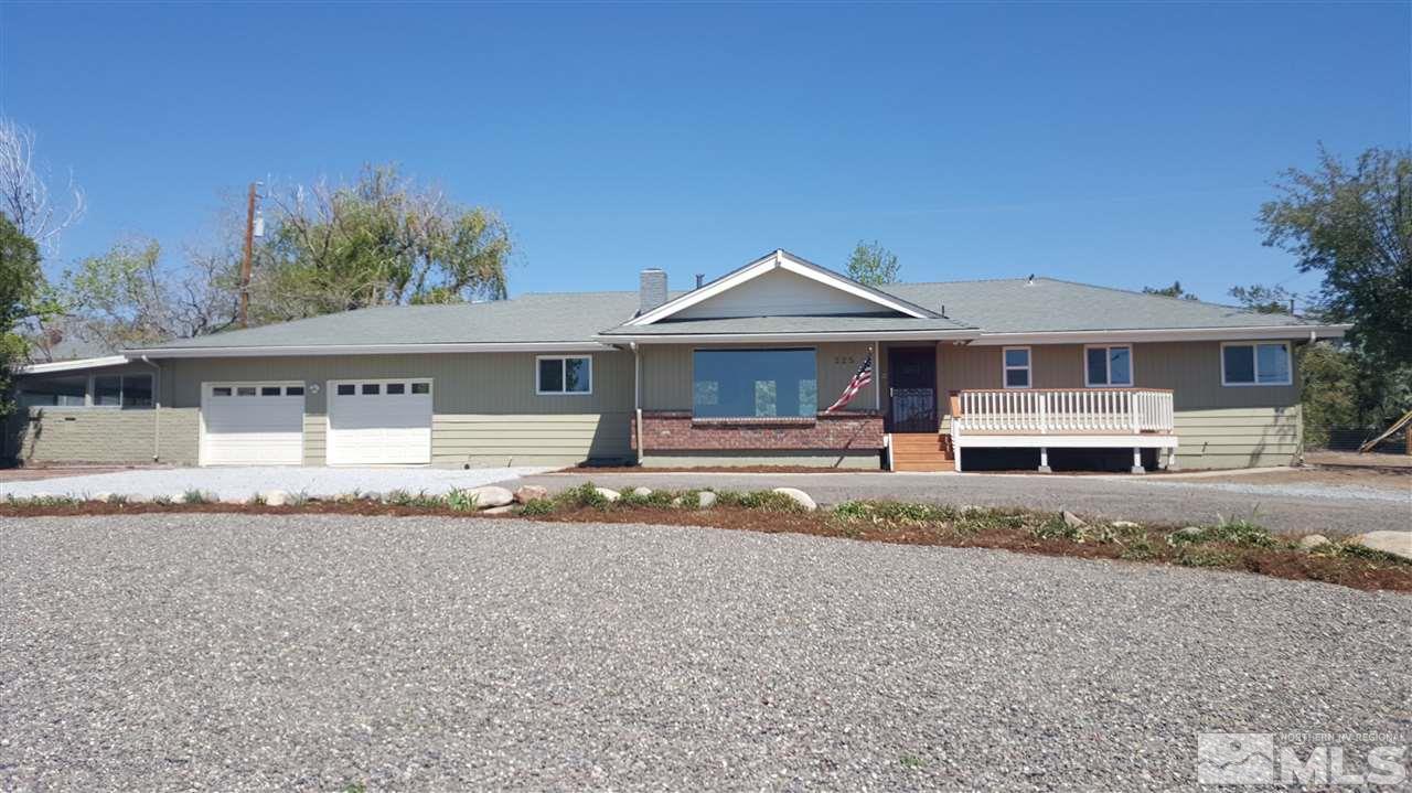 225 Greenstone Drive Reno, NV 89512 - Photo 1 of 1 a front view of a house with a yard