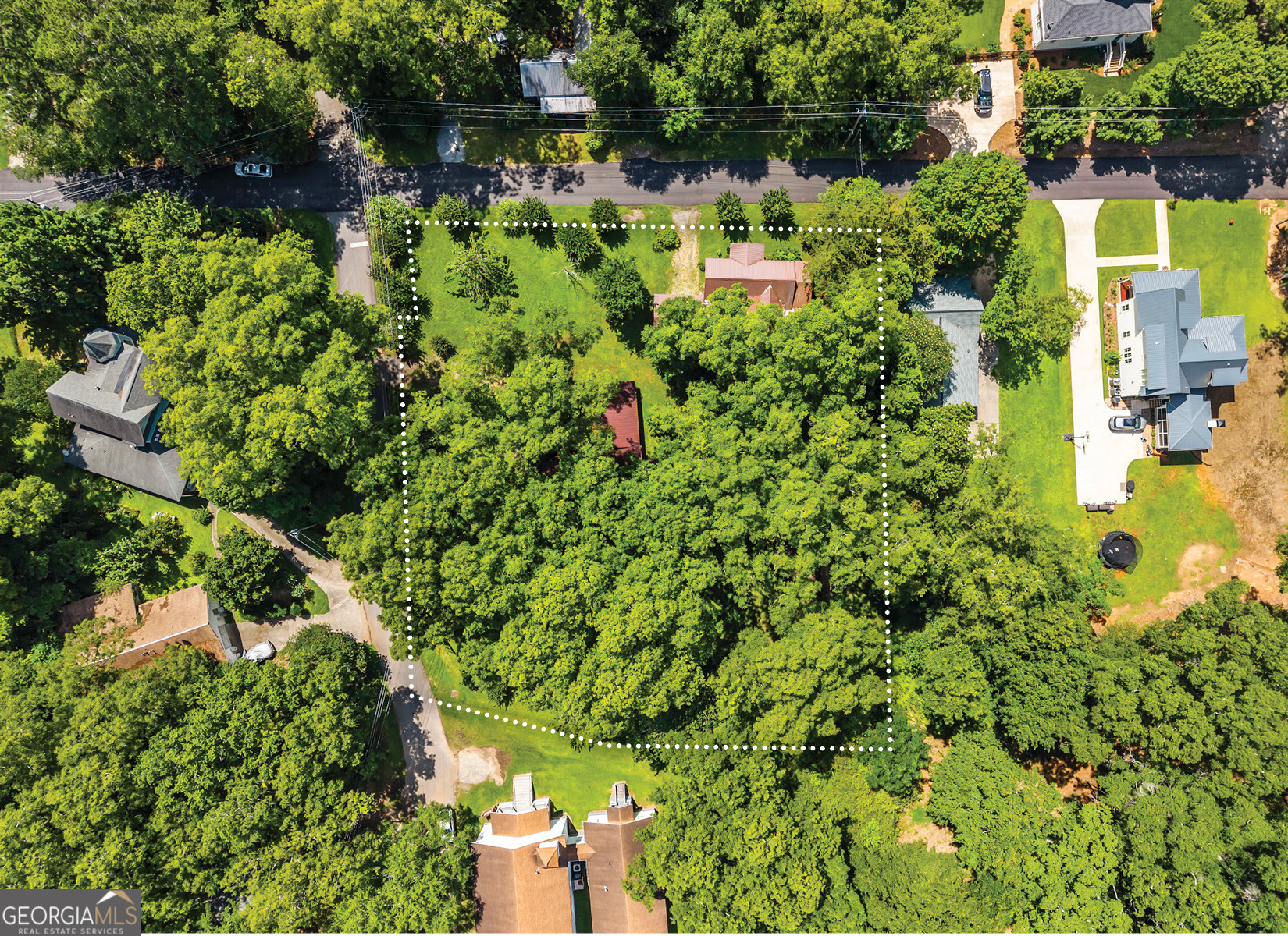 546 South 4th Street Madison, GA 30650 - Photo 2 of 22 an aerial view of residential house with outdoor space and trees all around