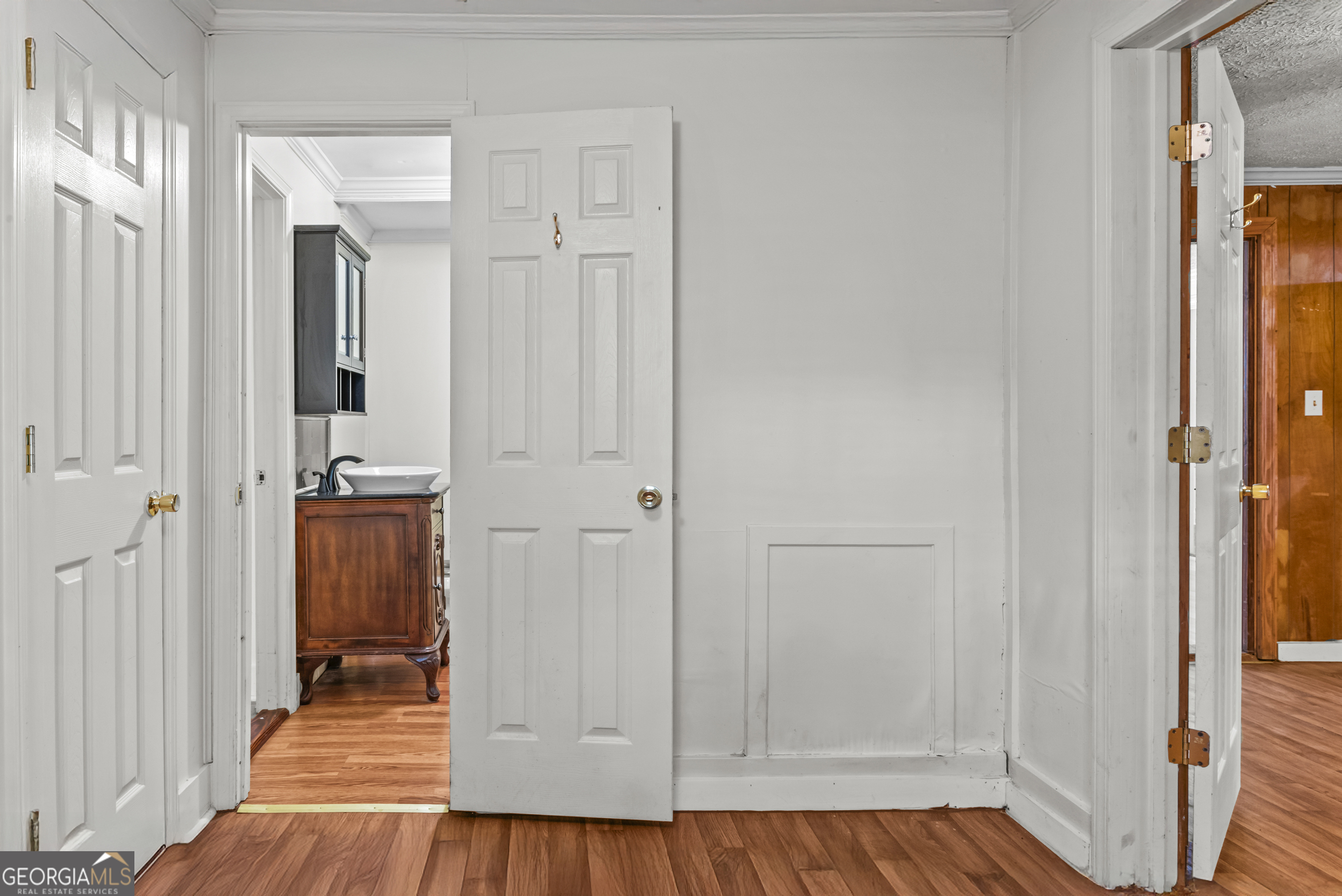 546 South 4th Street Madison, GA 30650 - Photo 21 of 22 a view of a hallway with wooden floor and staircase