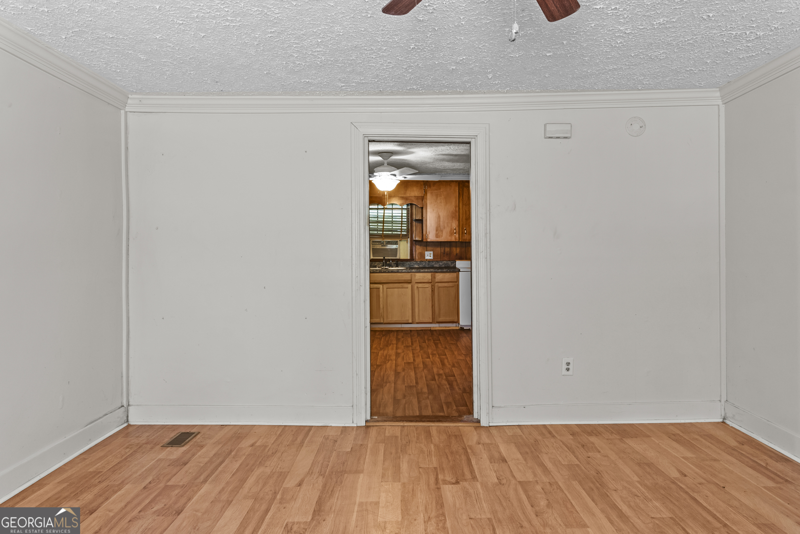 546 South 4th Street Madison, GA 30650 - Photo 10 of 22 a view of a hardwood floor in a room