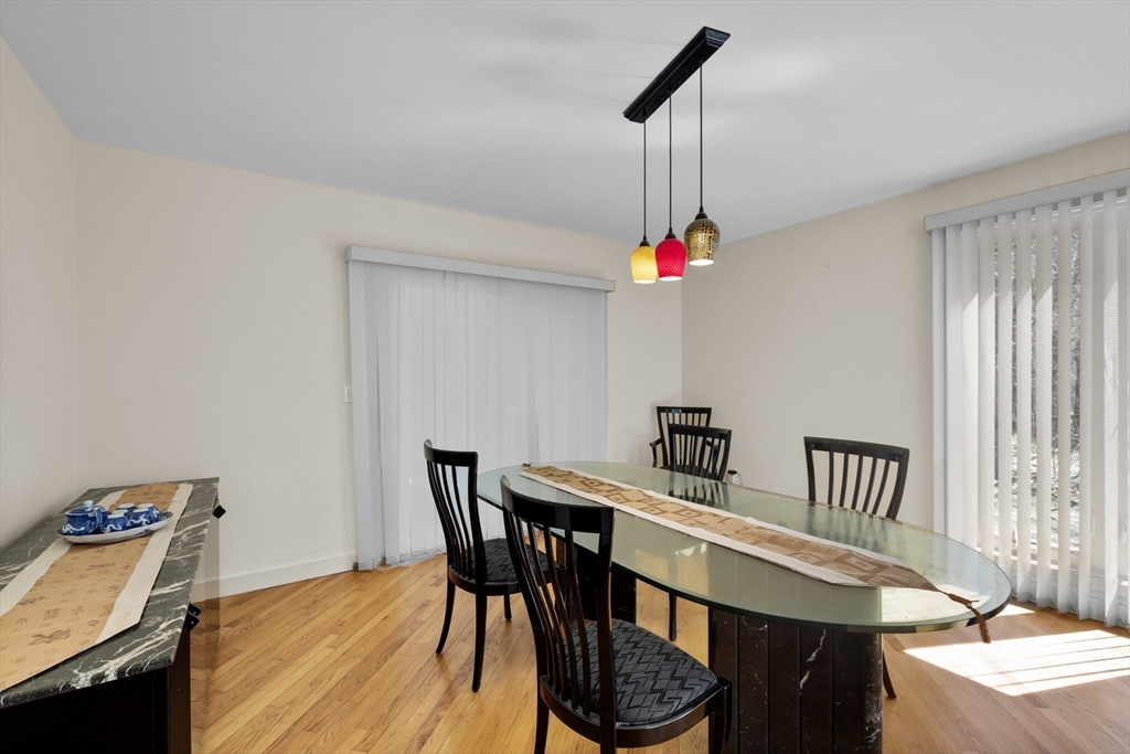 70 Cutters Ridge Road Carlisle, MA 01741 - Photo 11 of 36 a view of a dining room with furniture and wooden floor