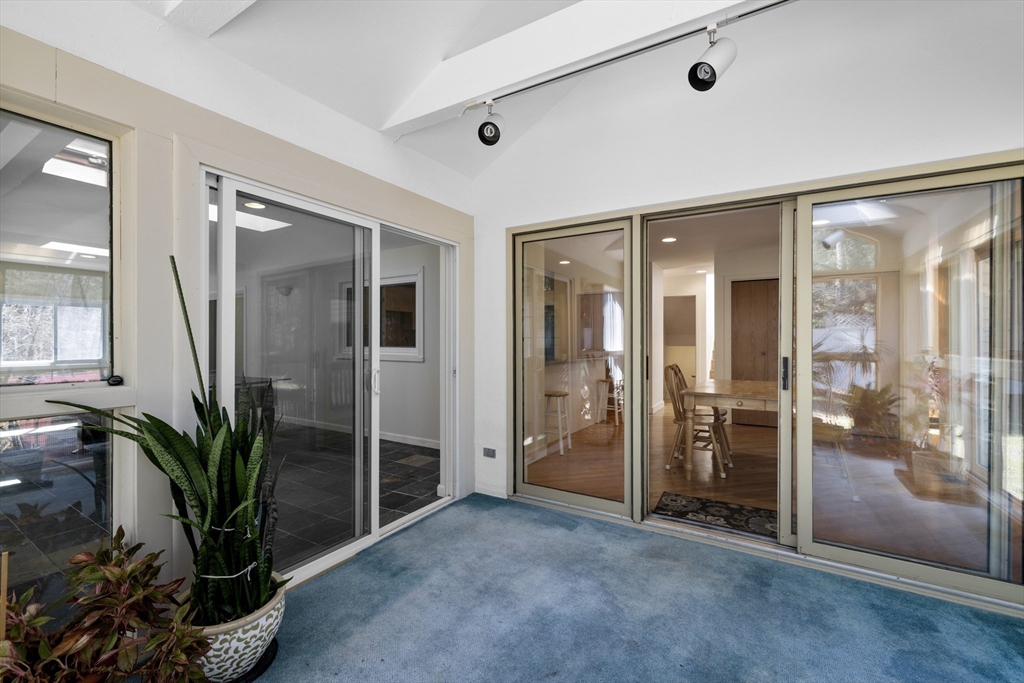 70 Cutters Ridge Road Carlisle, MA 01741 - Photo 14 of 36 an empty room with floor to ceiling window and potted plant