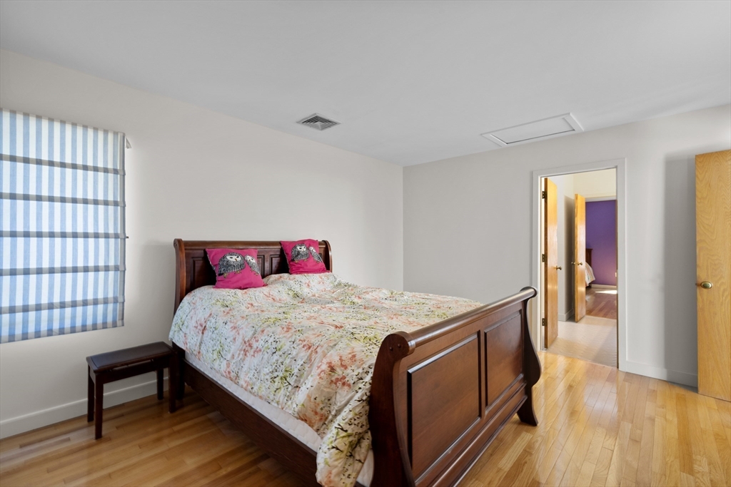 70 Cutters Ridge Road Carlisle, MA 01741 - Photo 22 of 36 a bedroom with a bed and a table