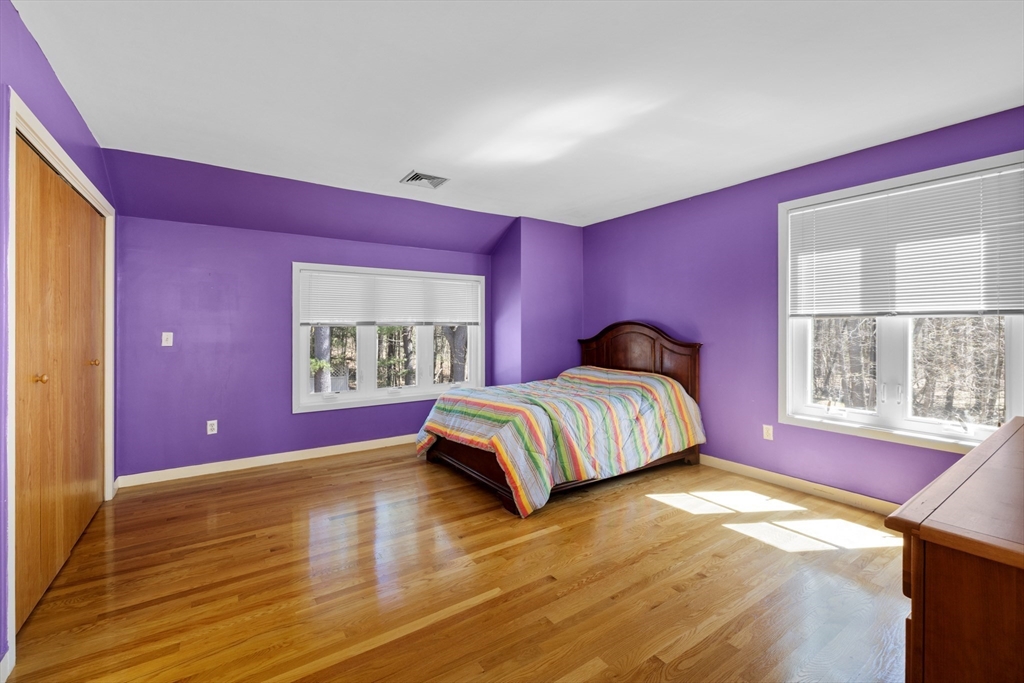 70 Cutters Ridge Road Carlisle, MA 01741 - Photo 23 of 36 a bedroom with a bed and a window