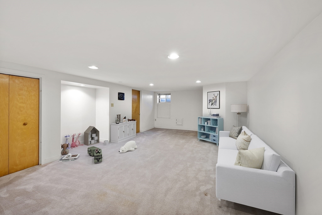 70 Cutters Ridge Road Carlisle, MA 01741 - Photo 25 of 36 a view of a livingroom with furniture and a couch