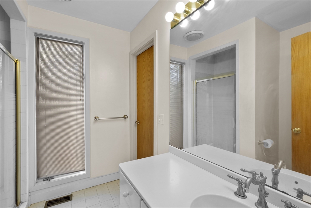 70 Cutters Ridge Road Carlisle, MA 01741 - Photo 28 of 36 a en suite bathroom with a sink and mirror