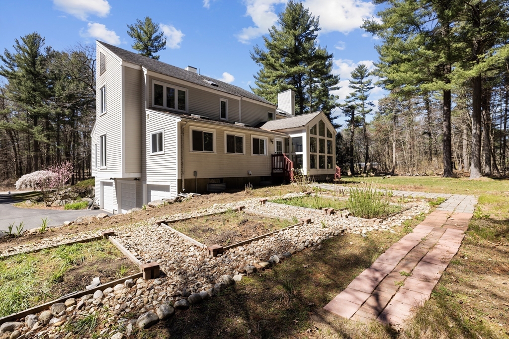 70 Cutters Ridge Road Carlisle, MA 01741 - Photo 34 of 36 a front view of a house with a yard