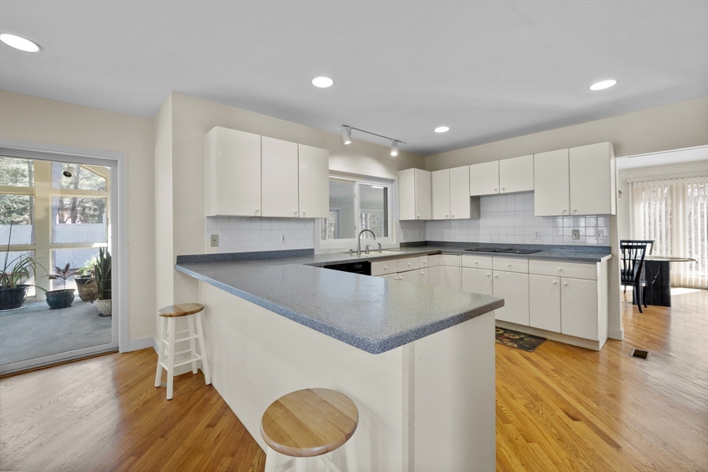 70 Cutters Ridge Road Carlisle, MA 01741 - Photo 5 of 36 a kitchen with stainless steel appliances granite countertop a sink stove and refrigerator