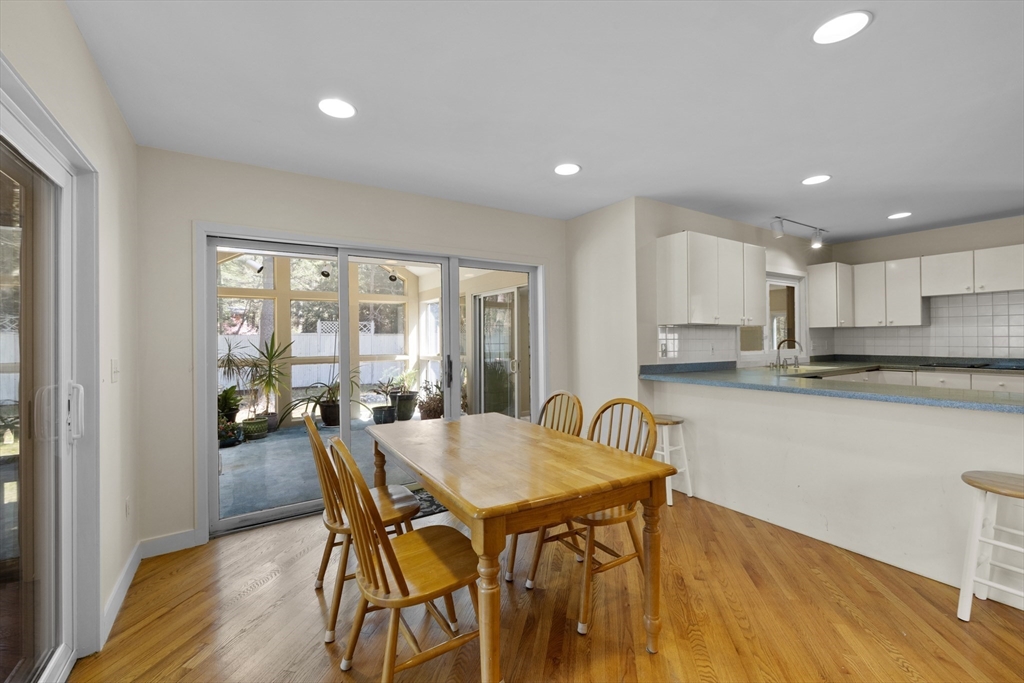 70 Cutters Ridge Road Carlisle, MA 01741 - Photo 7 of 36 a view of a dining room with furniture and wooden floor