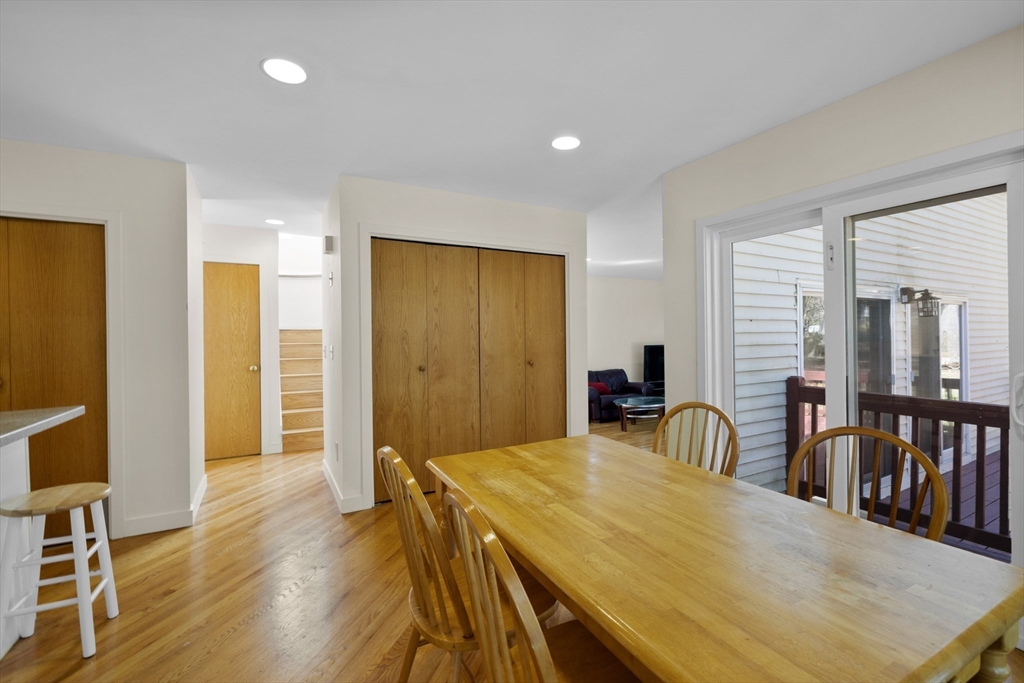 70 Cutters Ridge Road Carlisle, MA 01741 - Photo 9 of 36 a view of a dining room with furniture and wooden floor