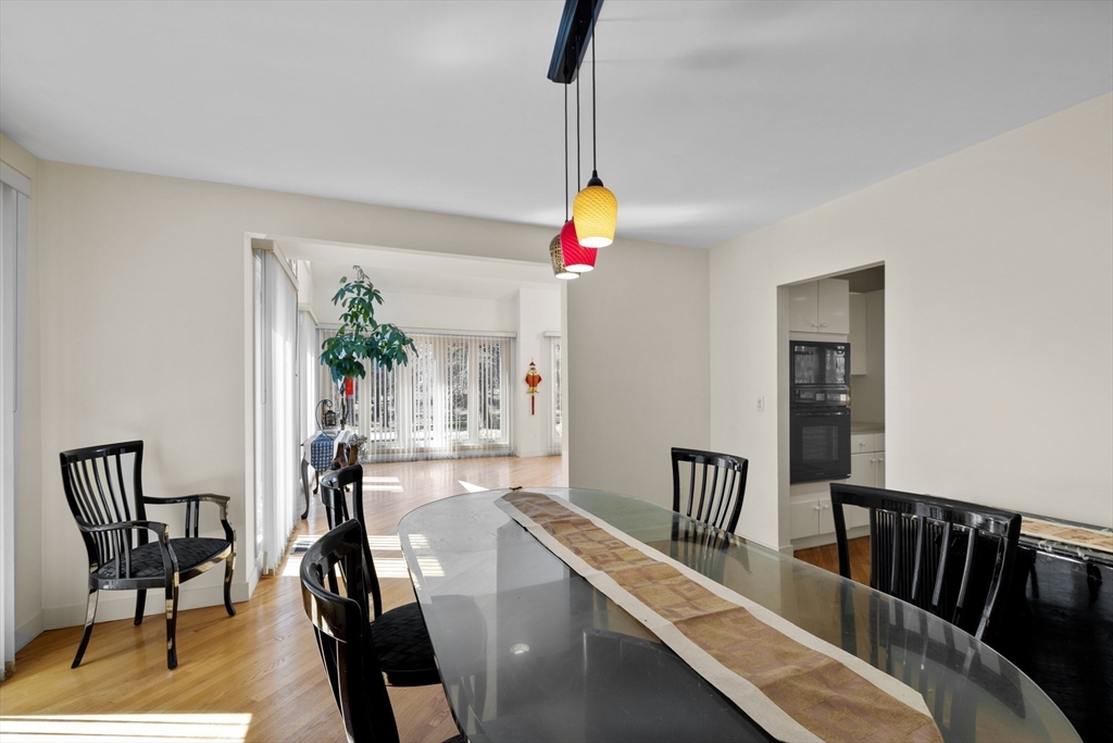 70 Cutters Ridge Road Carlisle, MA 01741 - Photo 10 of 36 a view of a dining room with furniture wooden floor and chandelier
