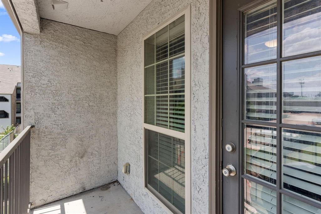 6108 Abrams Road, Unit 521 Dallas, TX 75231 - Photo 4 of 20 Private balcony featuring stucco exterior walls, concrete flooring, and metal railing