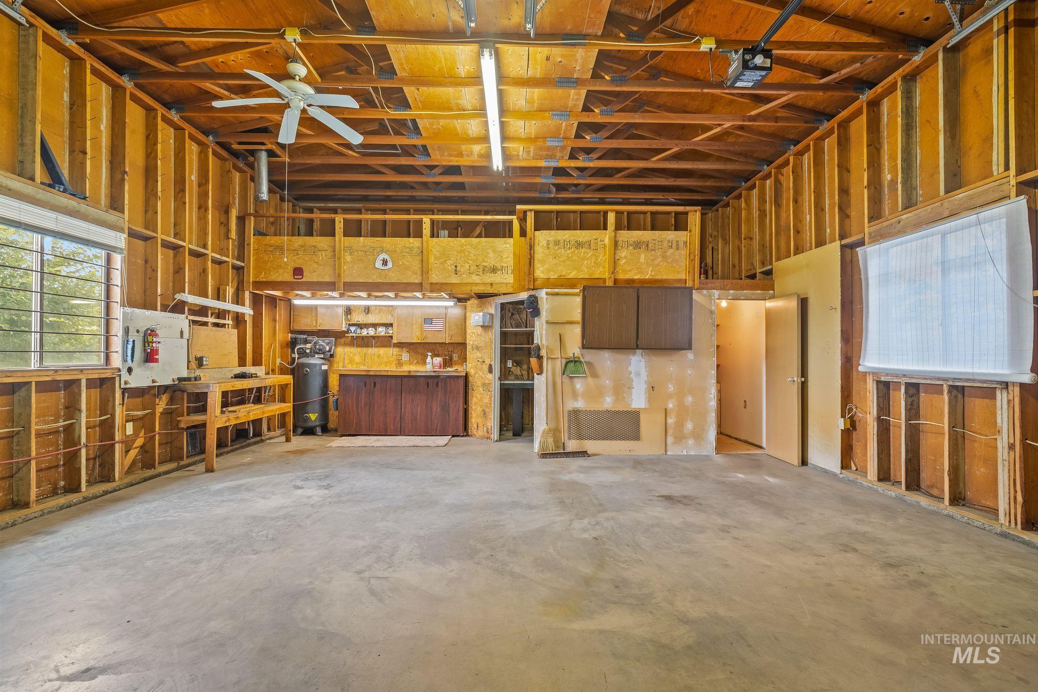 1721 3rd Street Lewiston, ID 83501 - Photo 25 of 45 Spacious unfinished garage with exposed wood framing and high ceilings