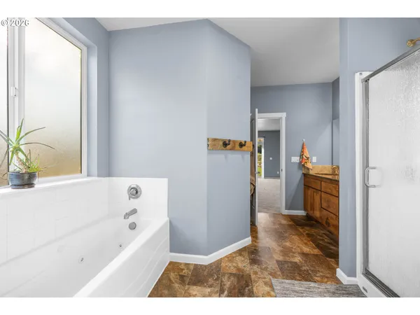 a bathroom with a bathtub and a sink