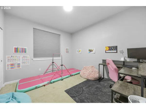 a bedroom with a bed and a couch