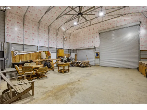 a view of a patio with table and chairs