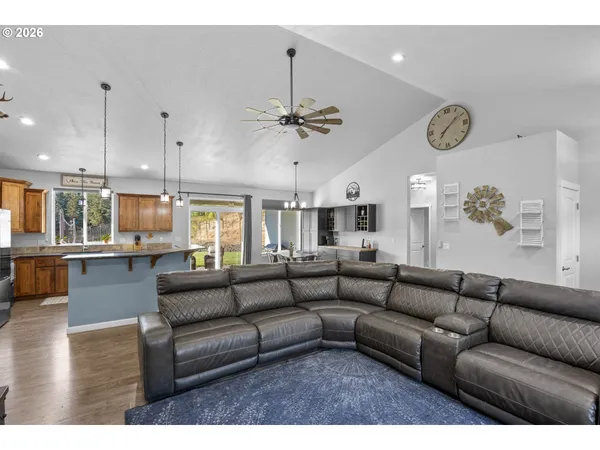a living room with furniture ceiling and a window