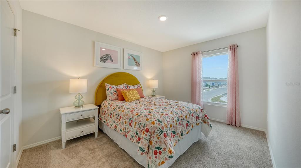 13113 Bayberry Way Parrish, FL 34219 - Photo 12 of 20 a bedroom with a bed and a window