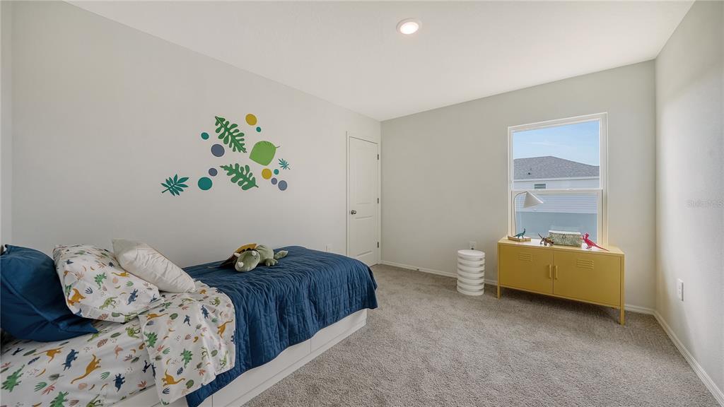 13113 Bayberry Way Parrish, FL 34219 - Photo 14 of 20 a bedroom with a bed and a window